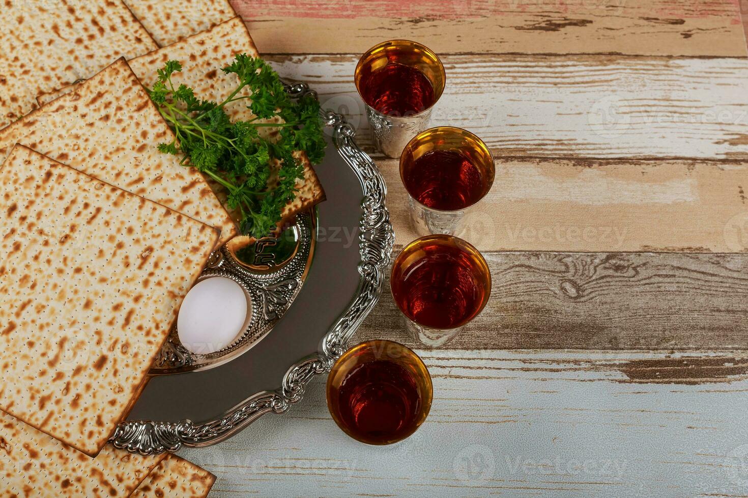 Matzo, egg and wine for passover celebration photo