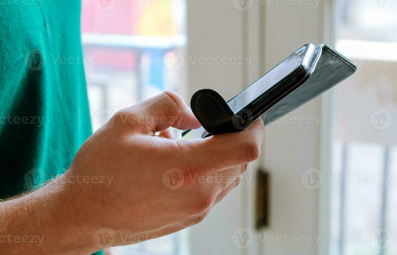 Mobile phone in man hand photo