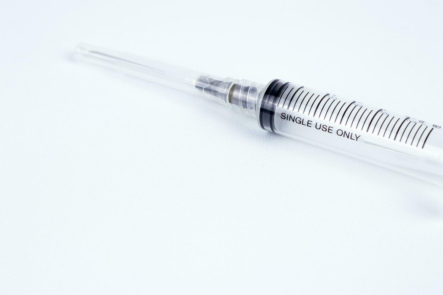 Disposable plastic syringe isolated on white background. Medicine and healthcare concept photo