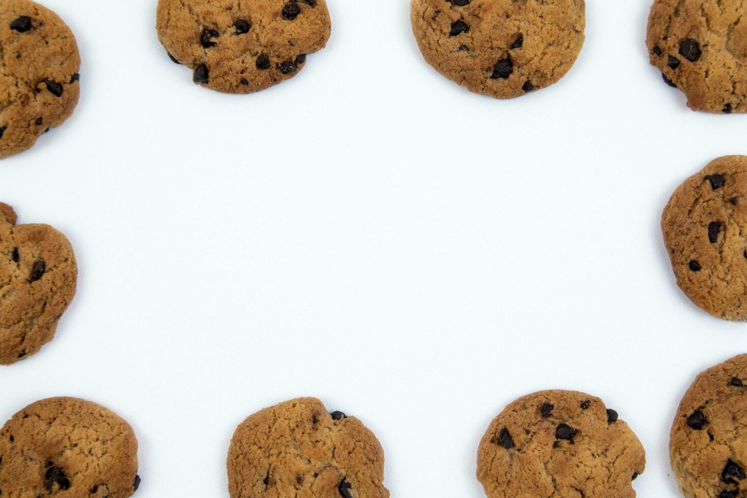 chocolate cookies frame on white background photo