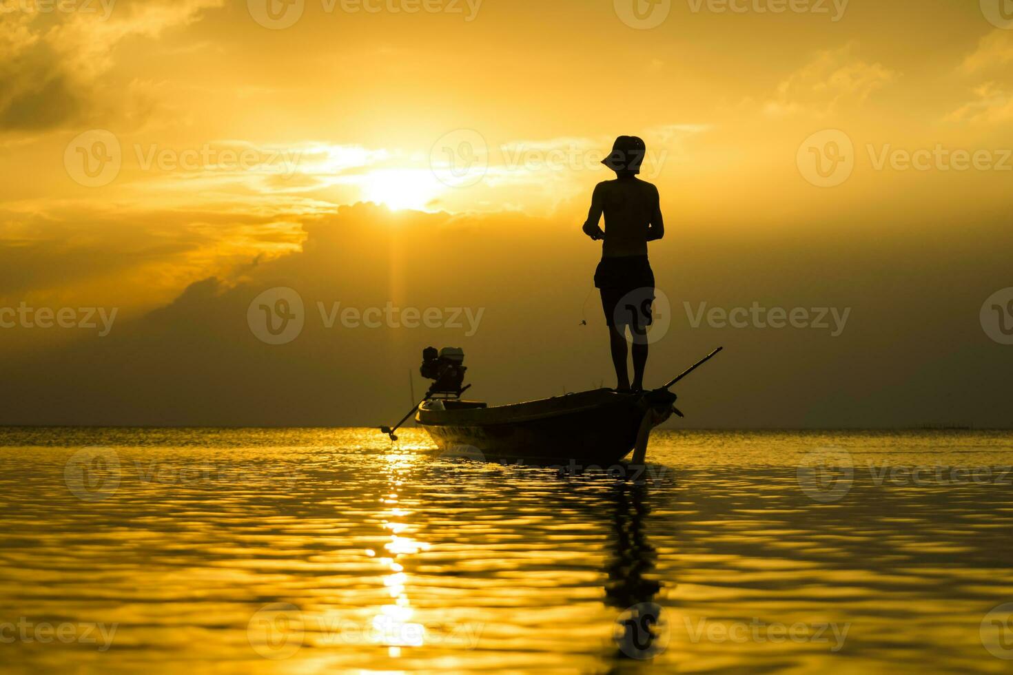 Silhouettes of fisherman at the lake with sunset, Thailand. photo