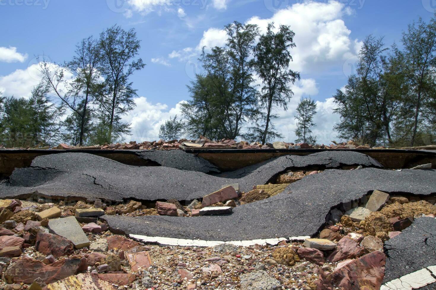 Road erosion caused by waves and severe storms. photo