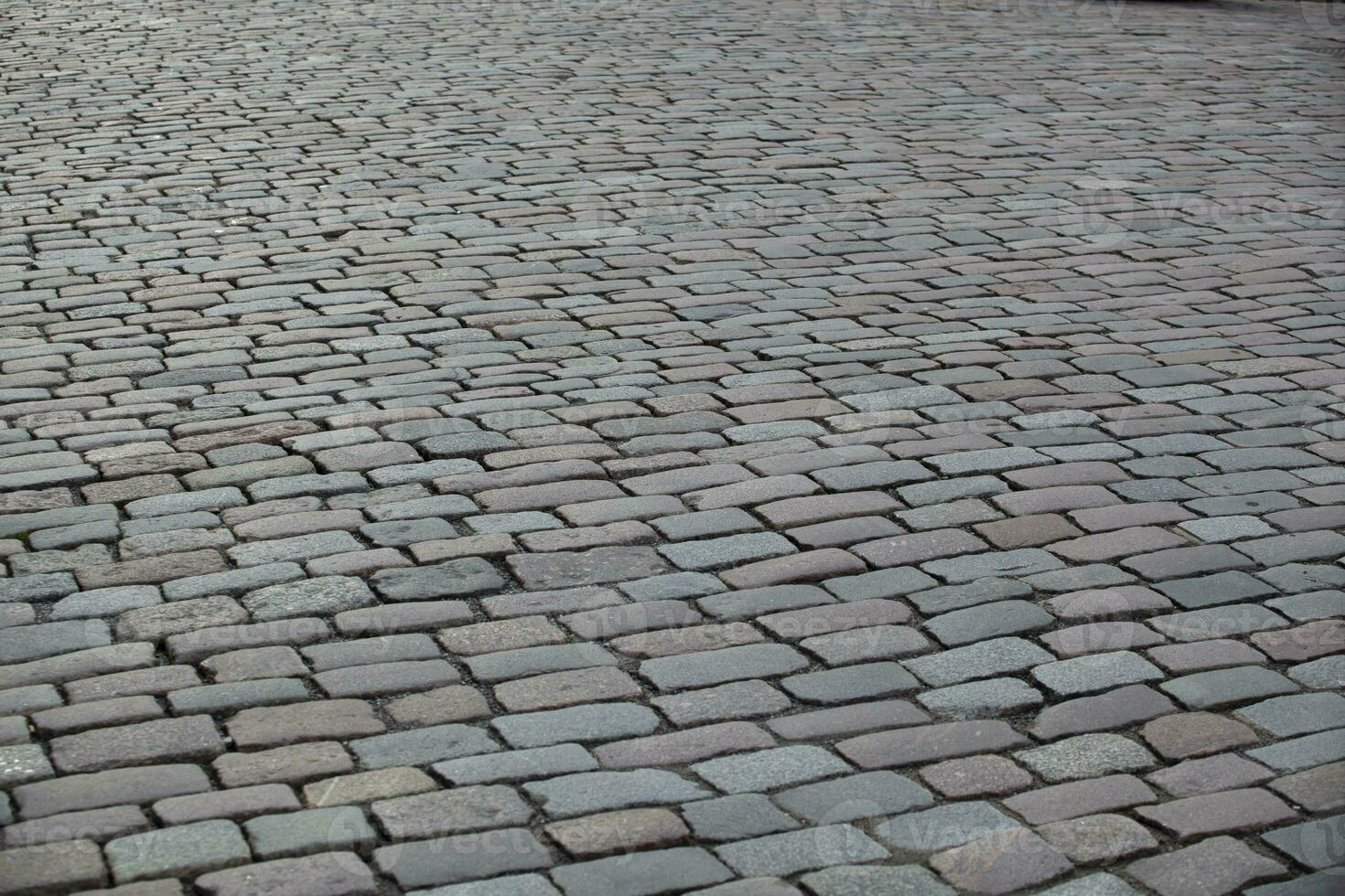 Street sidewalk texture in tile. Gray rectangular tile in perspective. Background. Horizontal. photo