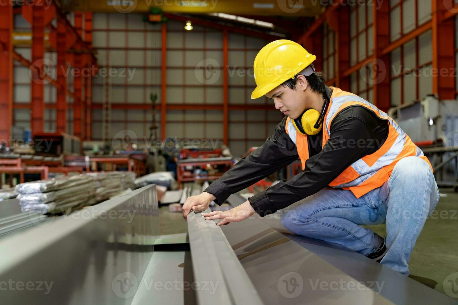 Engineering technician worker is measuring the steel from metal sheet forming machine inside the manufacturing factory for line production and industry photo