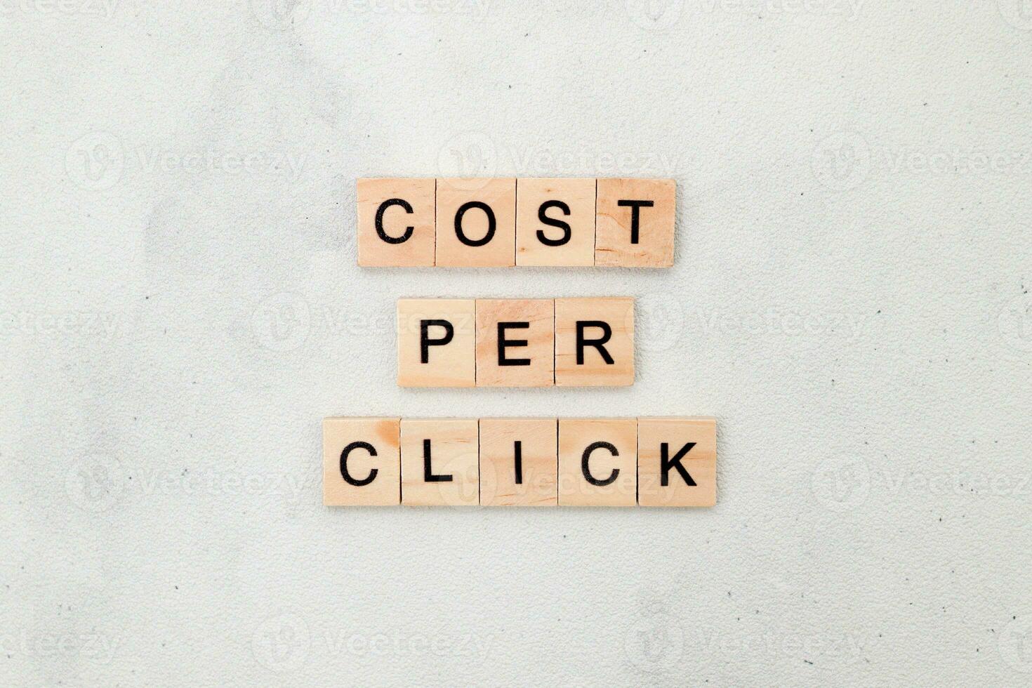 Top view of Cost Per Click word on wooden cube letter block on white background. Business concept photo