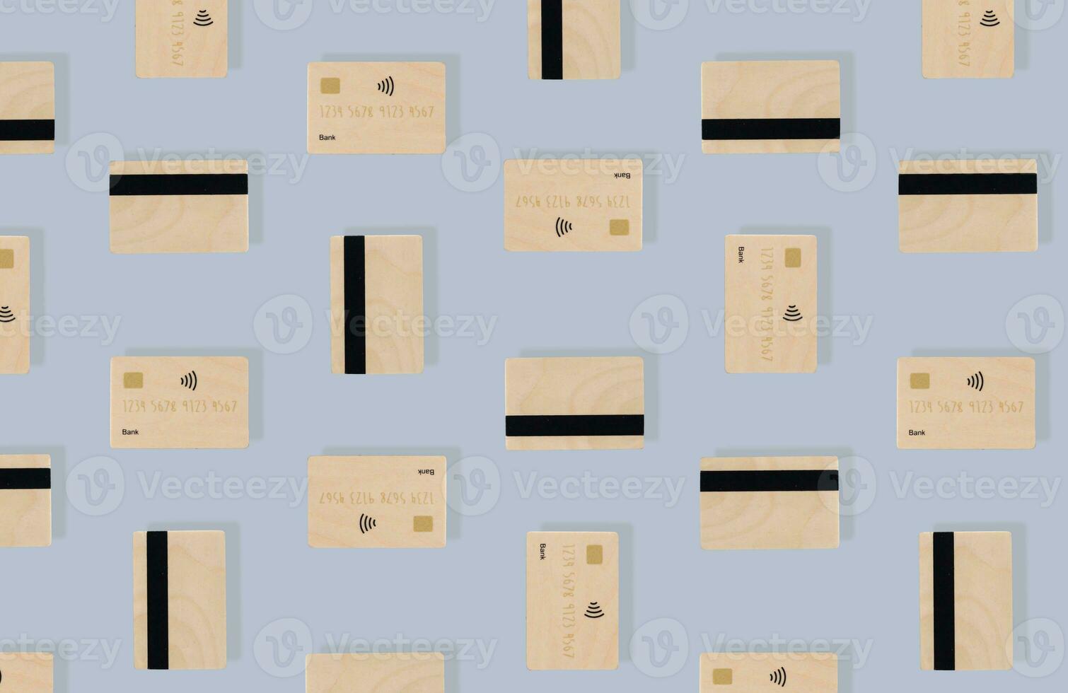 Creative pattern composition of credit cards on light grey background. Minimal banking concept. Online credit card payment for purchases from online shopping. Trendy business idea. Unique flat lay. photo