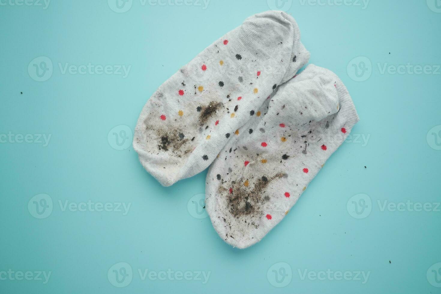 men dirty socks on black background photo