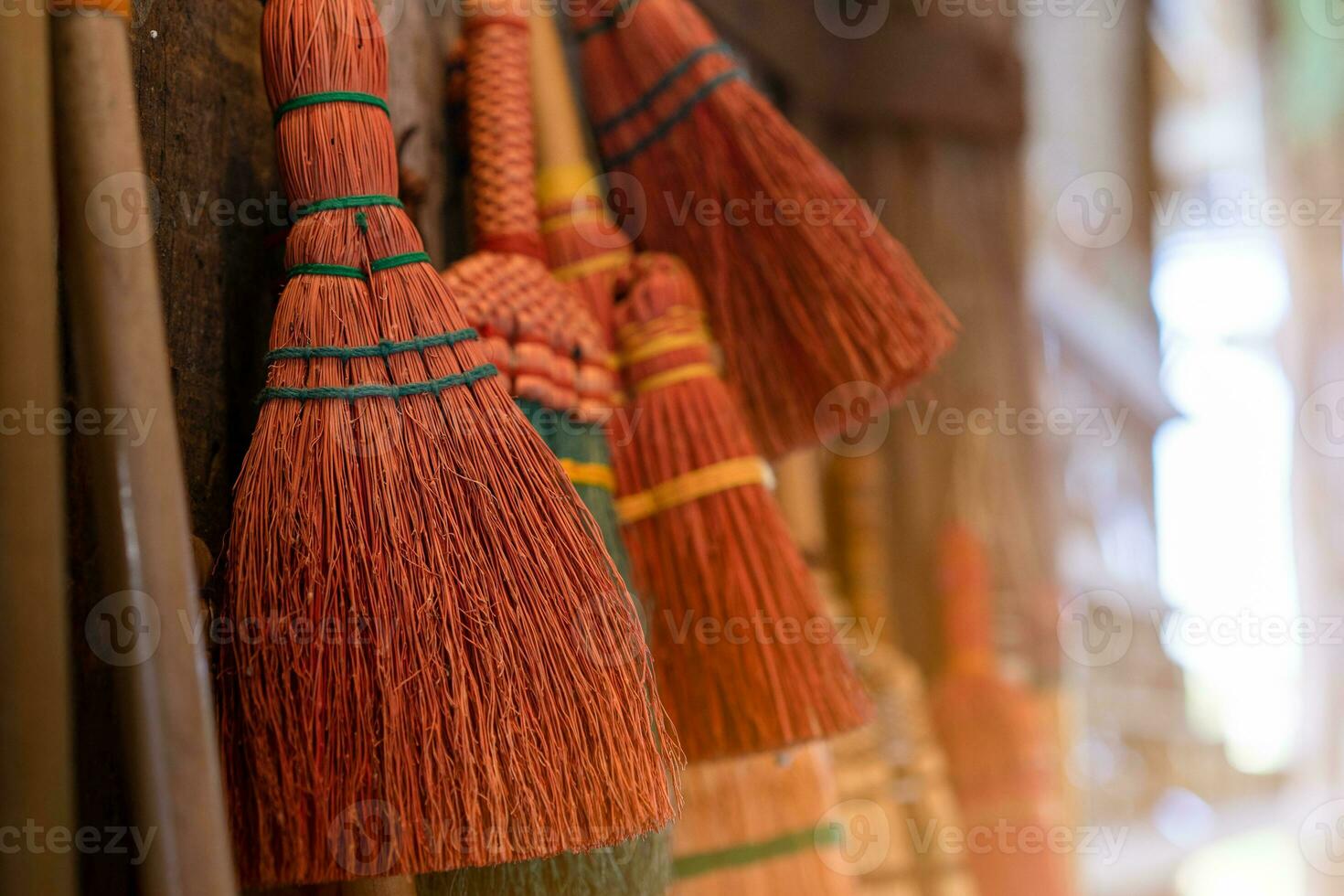 Broom hanging on the wall photo