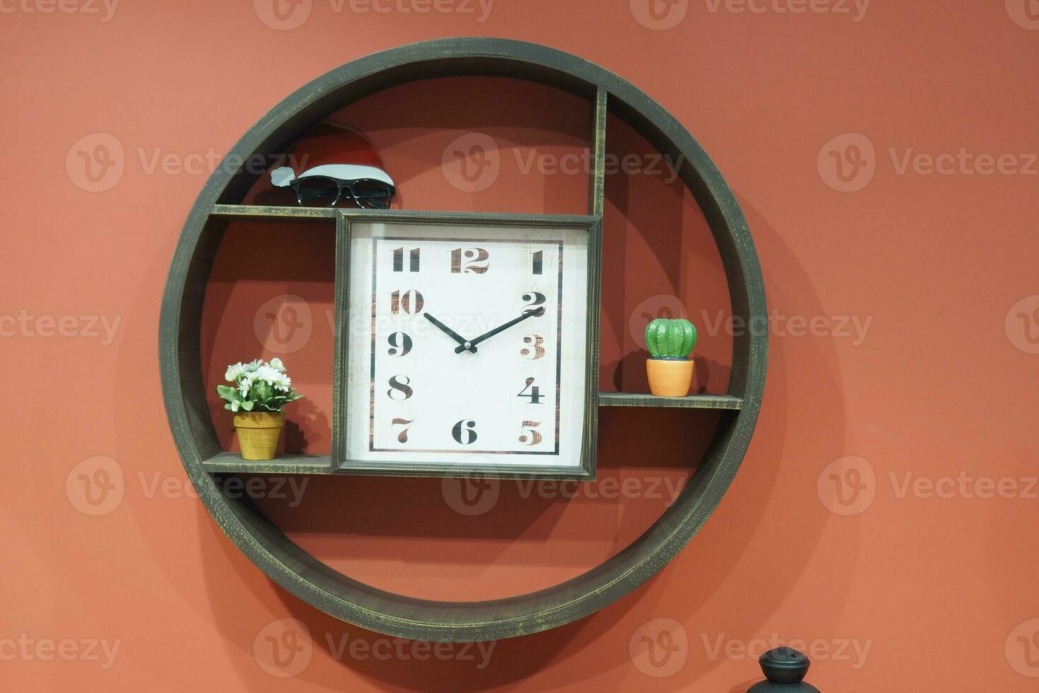 simple modern clock on orange color wall photo
