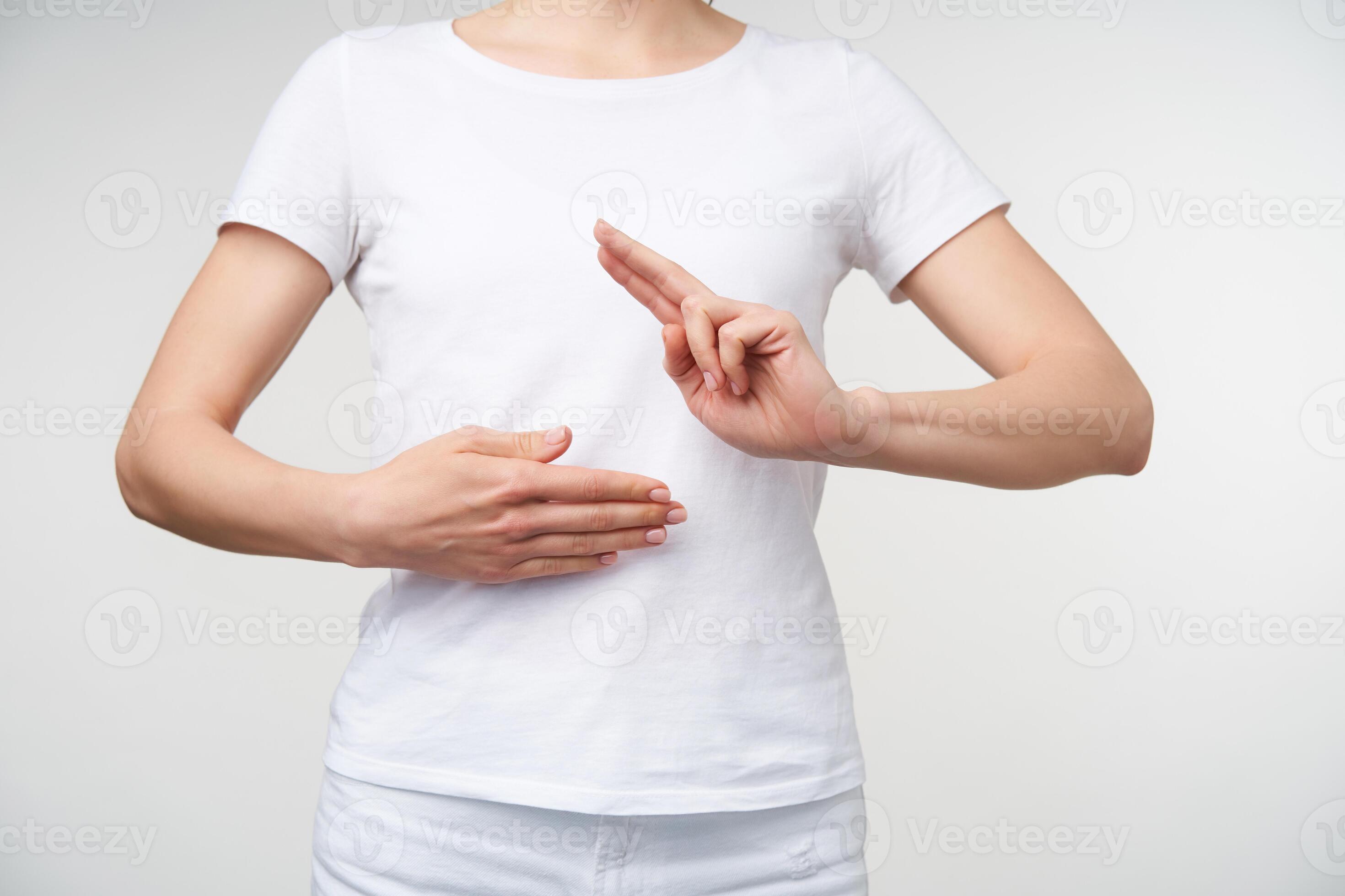 Horizontal photo of young woman keeping palm on her belly a raising