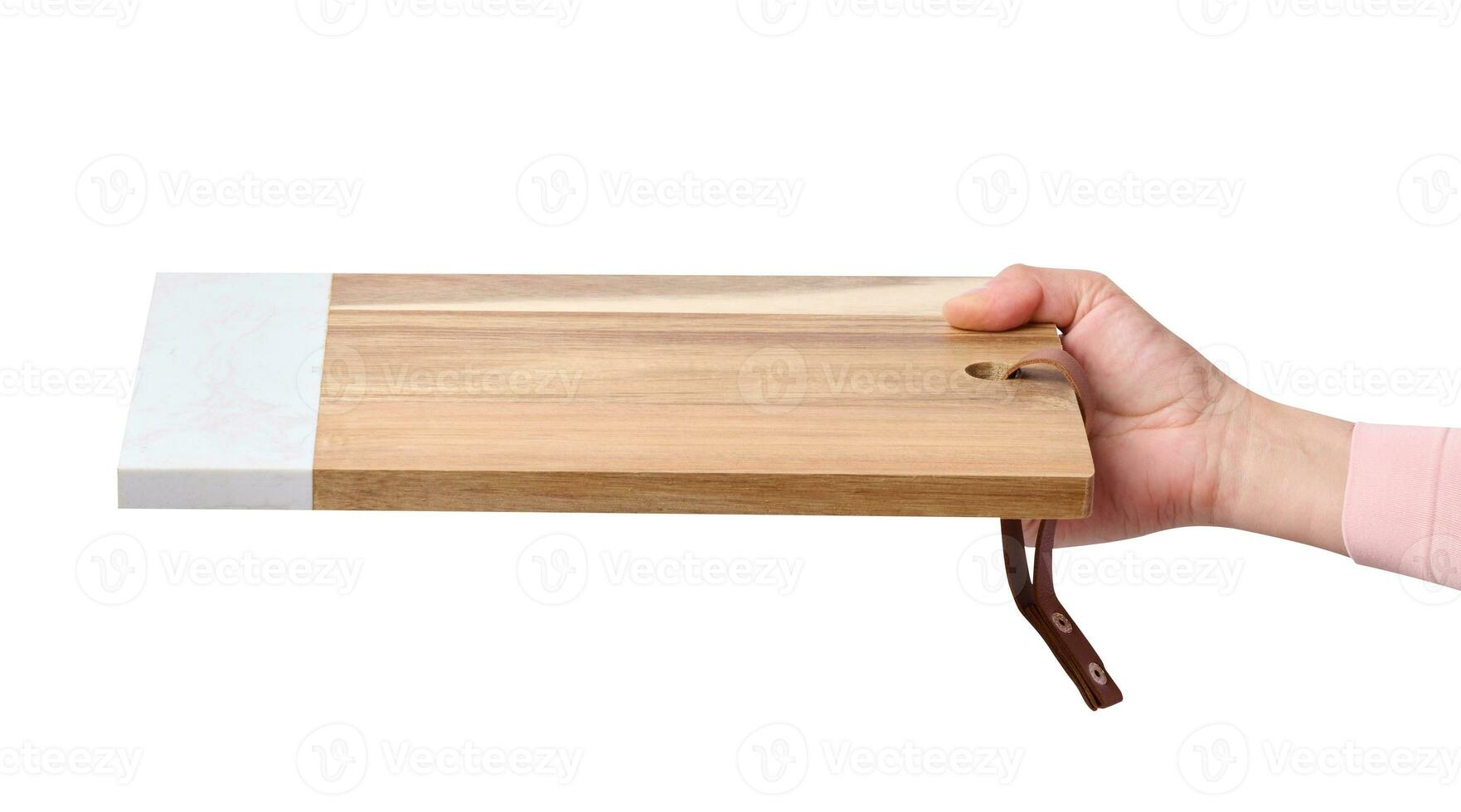 Female hand holding a rectangular empty kitchen board photo