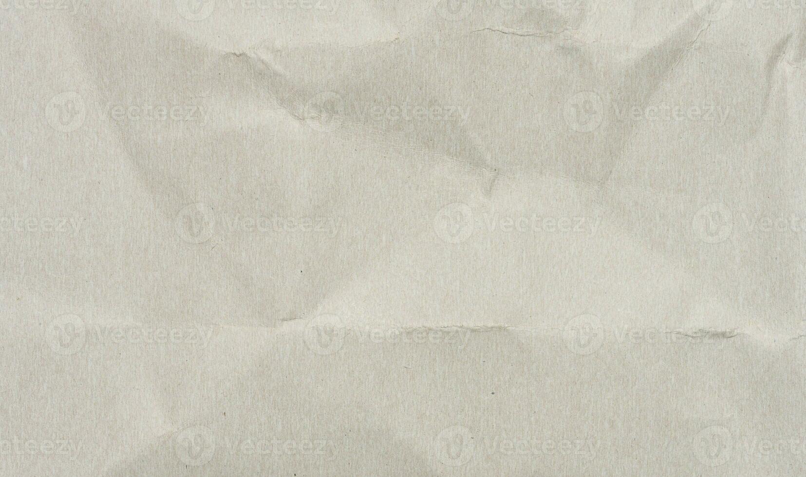 Crumpled gray sheet of cardboard, full frame photo