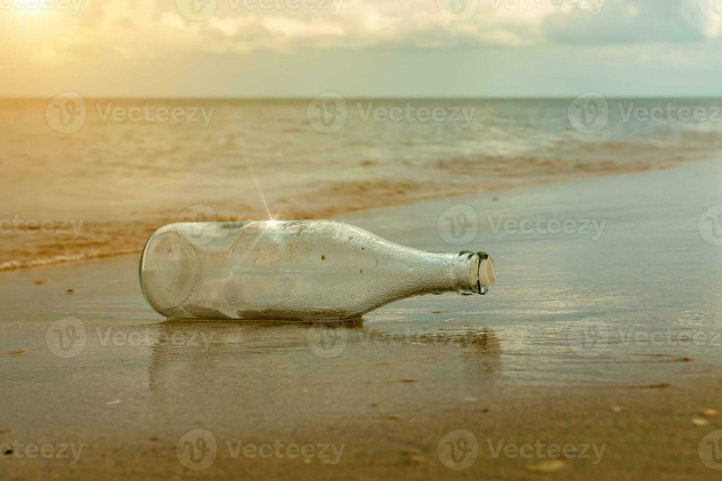 Glass bottles on the beach photo