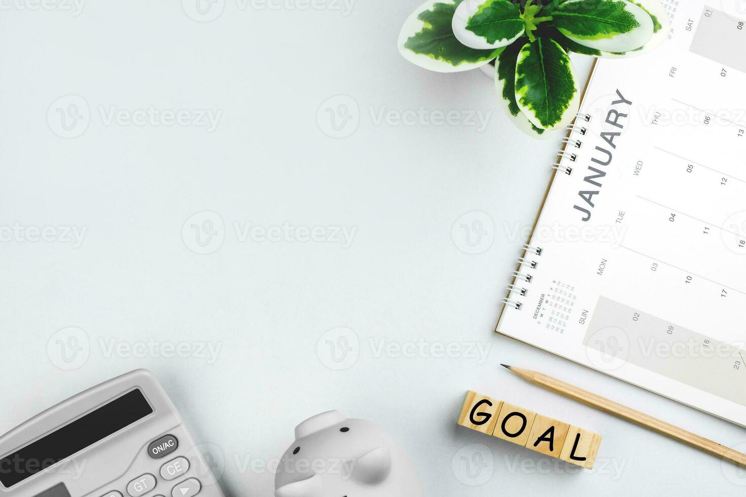 Top view of January calendar page. First month of new year on desk in white background. concept for planning and working goals in organization, cost, and income planning for startup new year photo