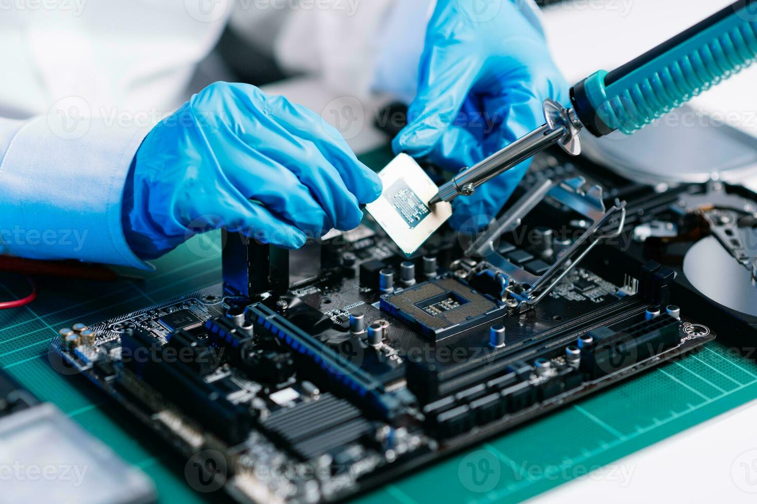 The technician repairing the motherboard in the lab with copy space. the concept of computer hardware, mobile phone, electronic, repairing, upgrade photo