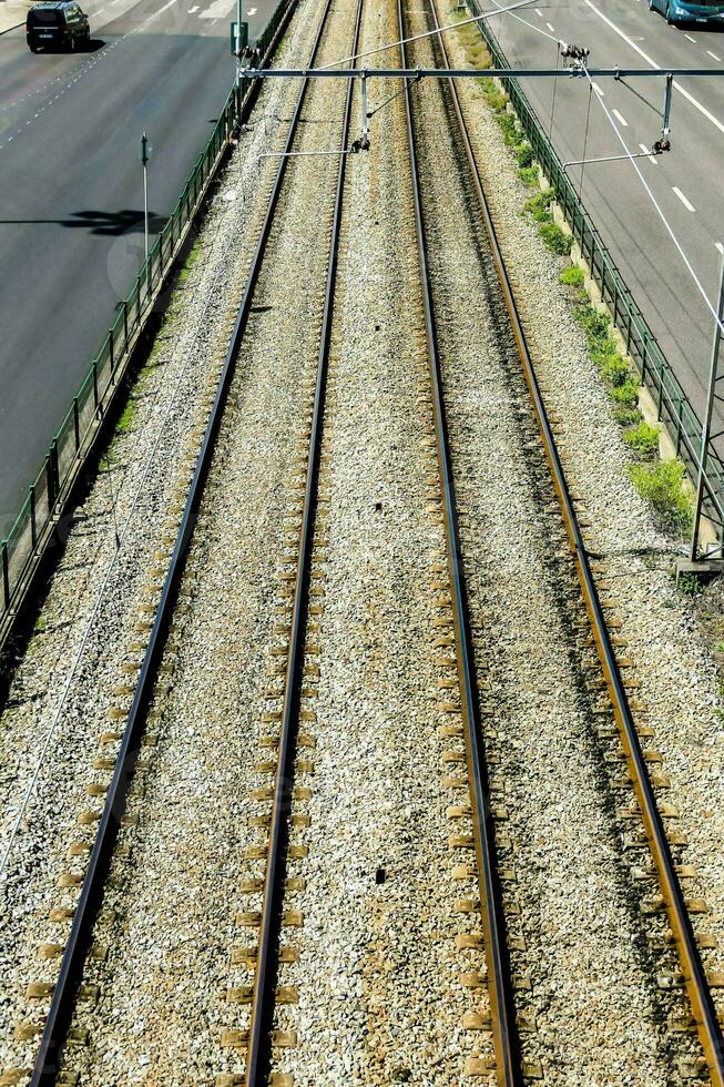 an overhead view of a train track with cars on it photo