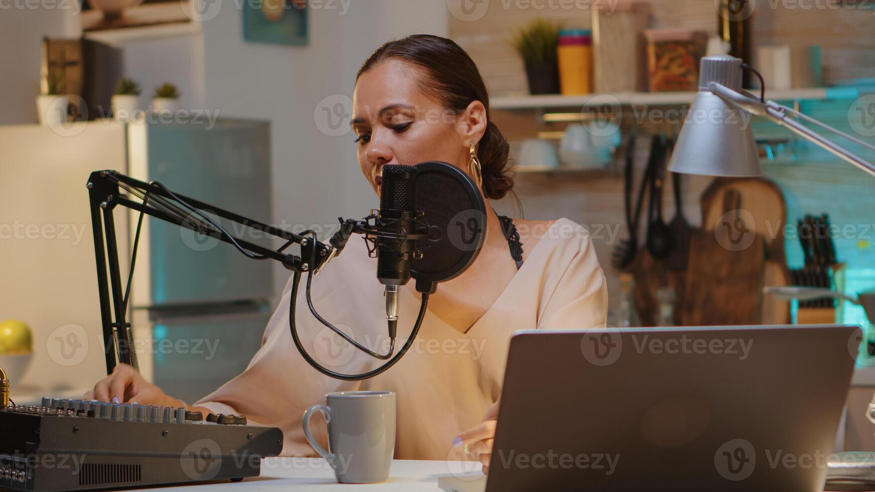 Famous woman holding professional microphone while recording podcast for social media. Onair online production internet broadcast show host streaming live content, recording digital social media communication photo