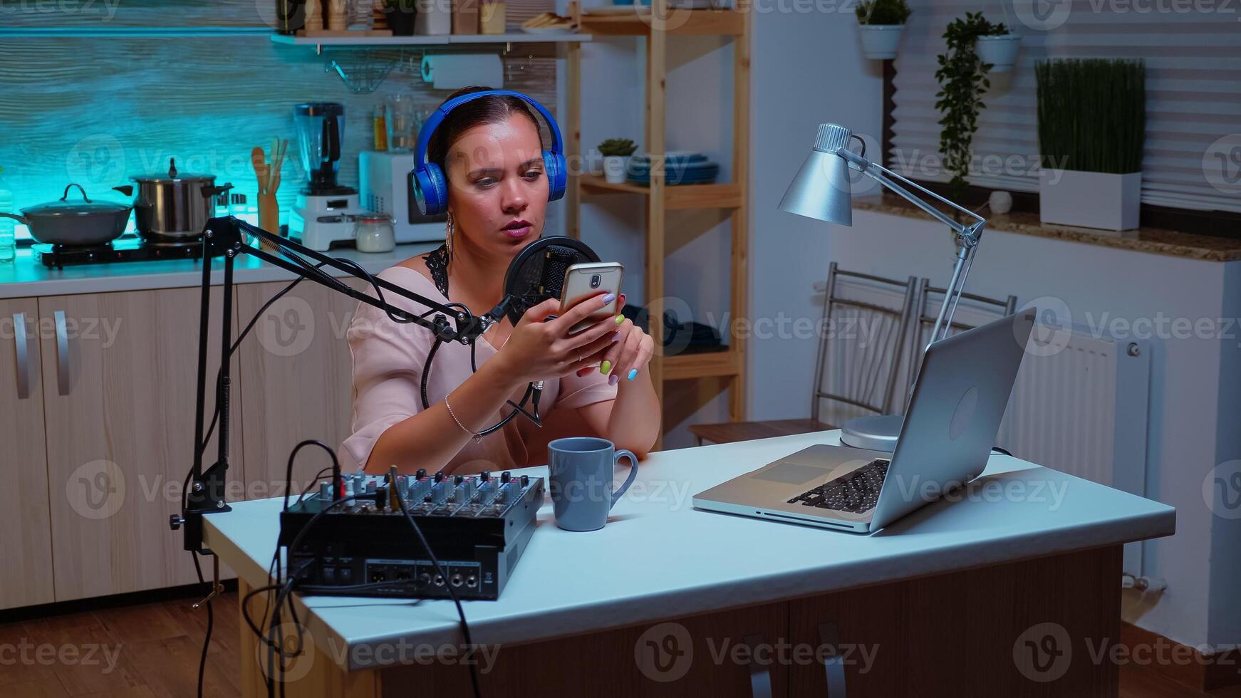 Speaking into professional microphone during podcast in home studio. Creative online show Onair production internet broadcast host streaming live content, recording digital social media communication photo