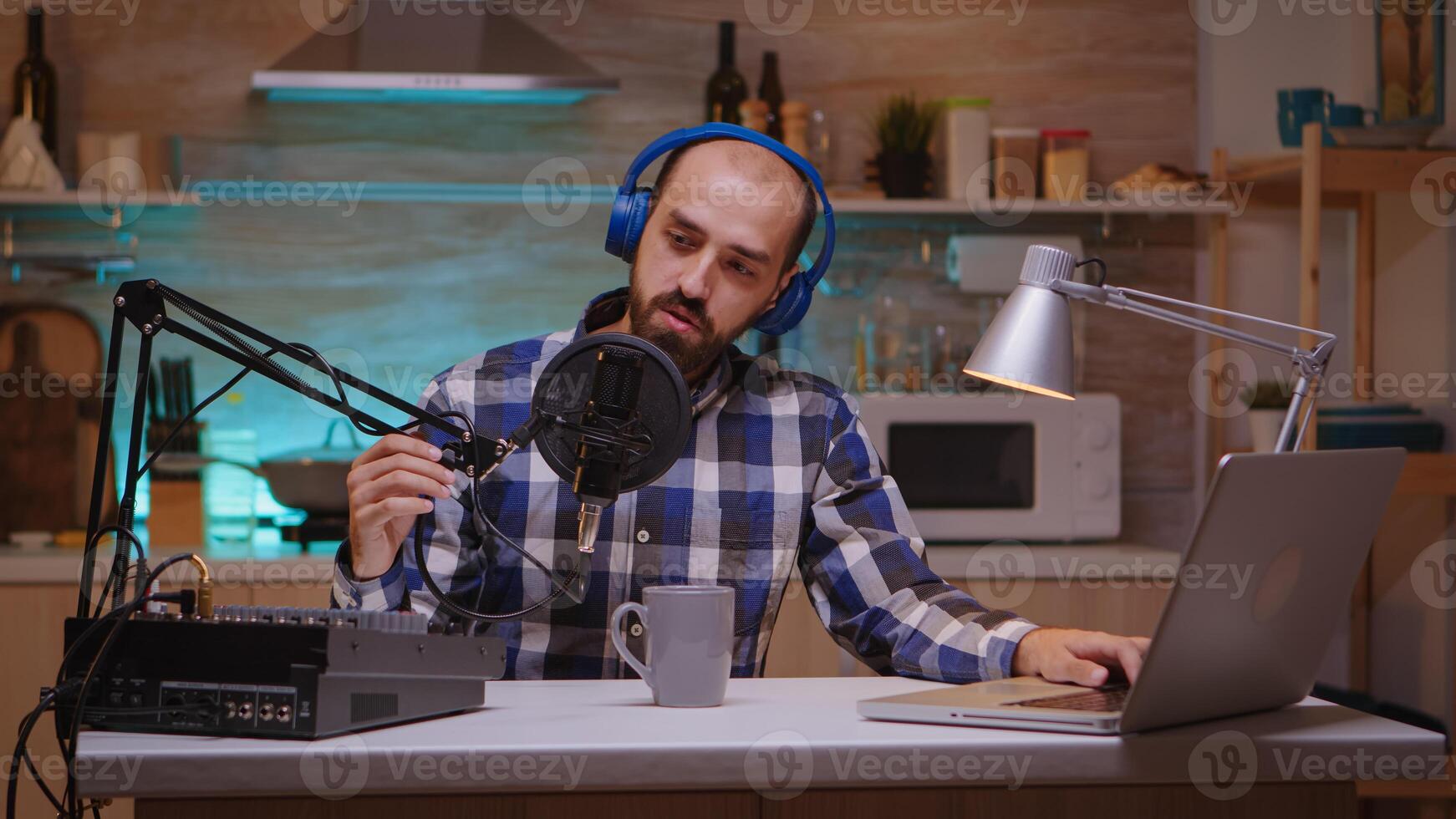 Presenter speaking about passions and entertainment in podcast wearing headphones. Creative online show Onair production internet broadcast host streaming live content, recording digital social media communication photo