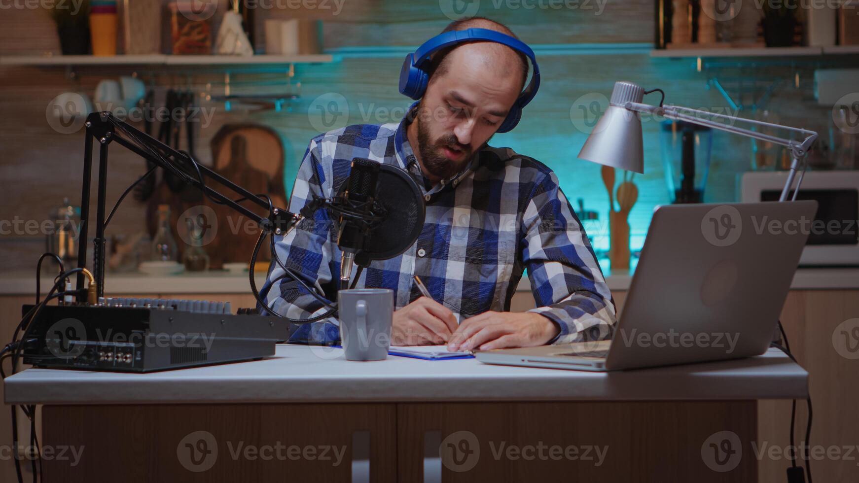 Zooming on bloger speaking on microphone telling a story during live on internet. Creative online show Onair production internet broadcast host streaming live content, recording digital social media communication photo