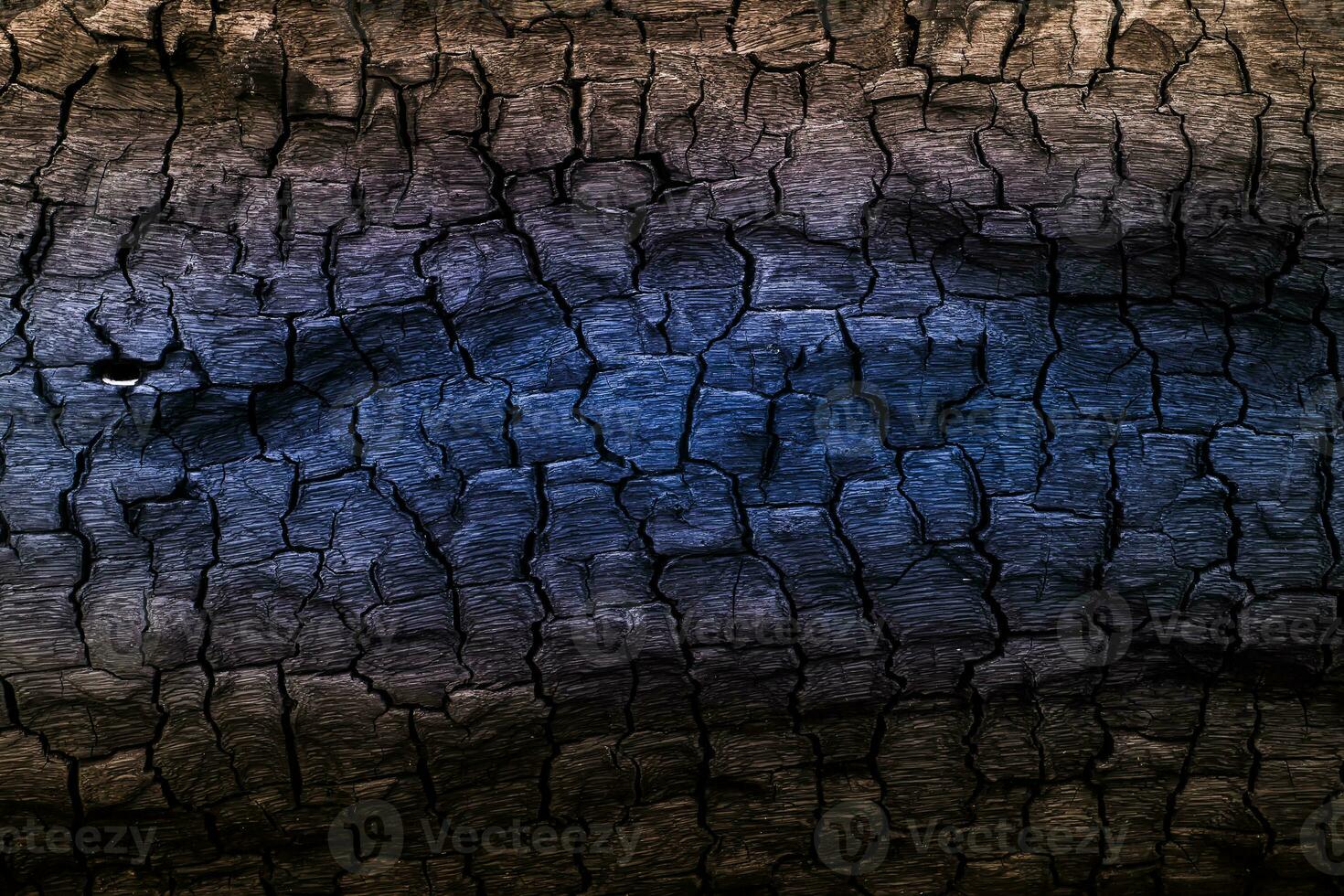 Details the surface of brown and blue charcoal. photo