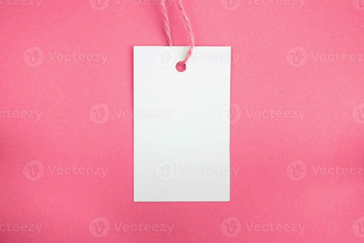 White price tag on a pik background. Mockup. Place for text. photo