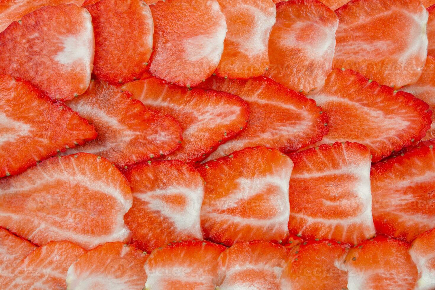 Fresh ripe strawberry pattern. Texture of sliced strawberries. photo