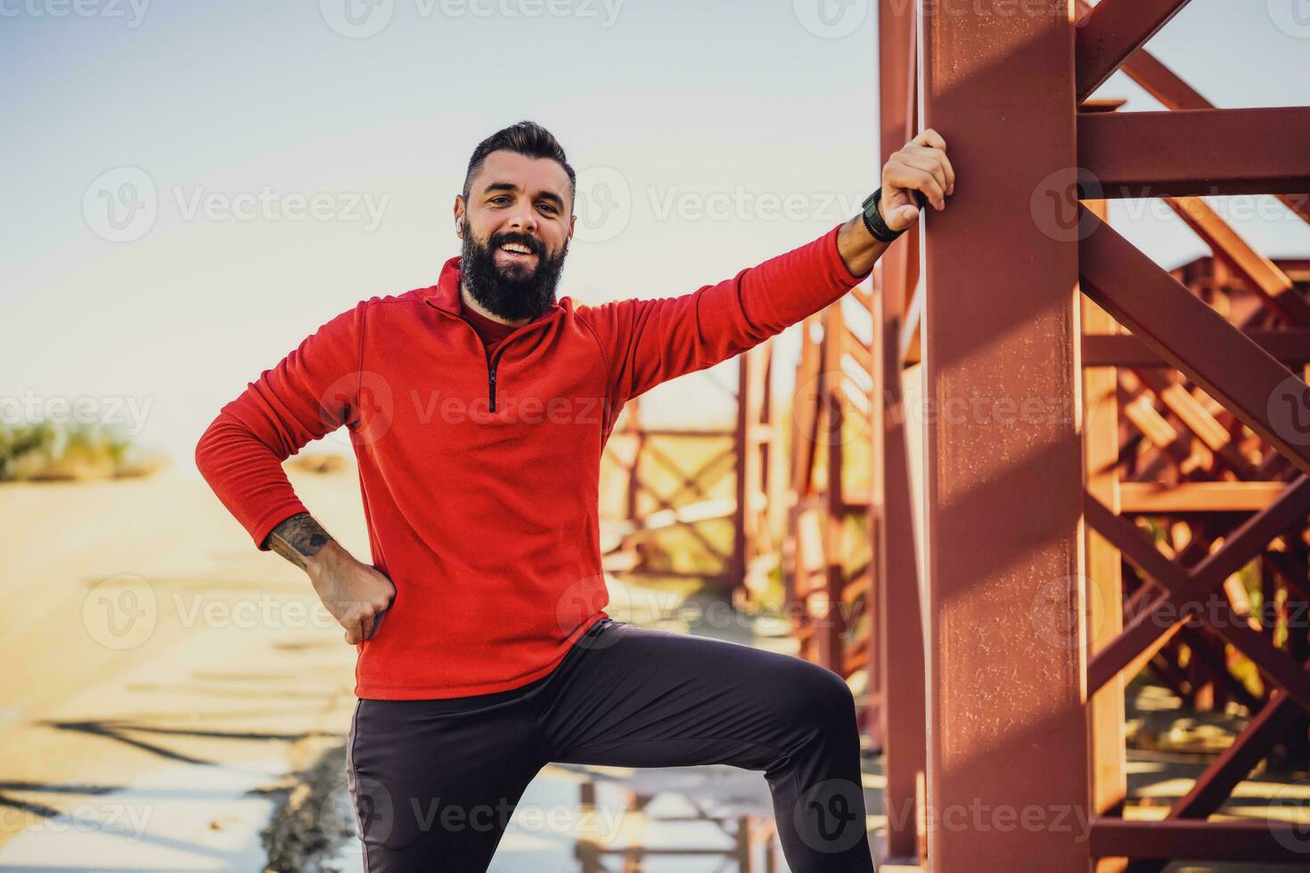Adult man is ready for exercising outdoor on sunny day. photo