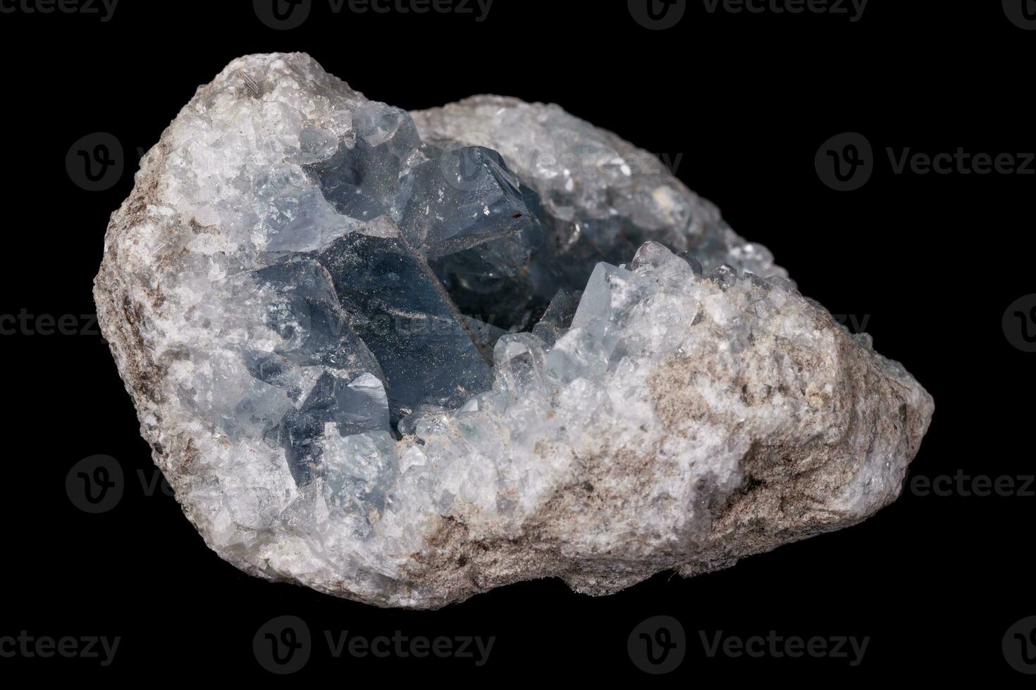 Celestine mineral stone macro on microcline on black background photo
