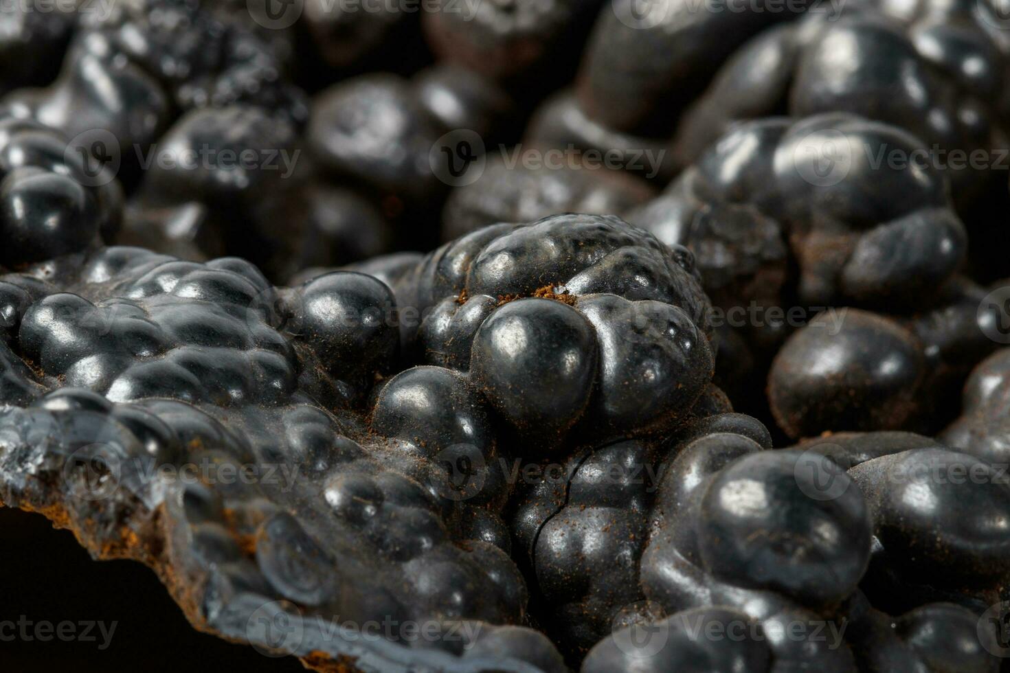 Macro mineral Hematite stone on a white background close-up photo