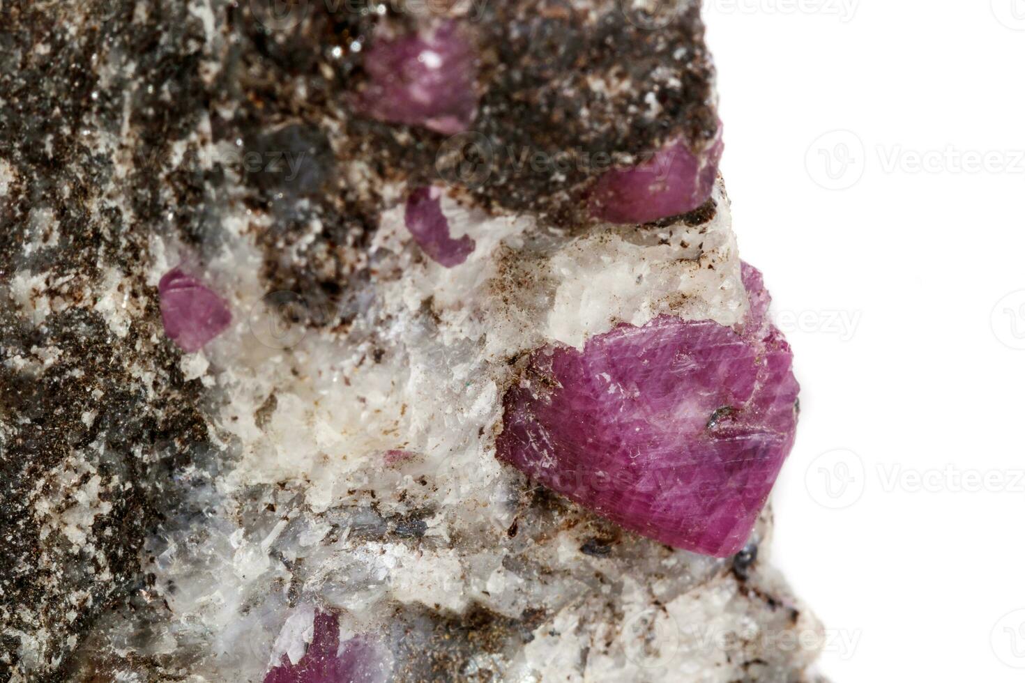 Macro of a mineral Ruby stone on a white background photo