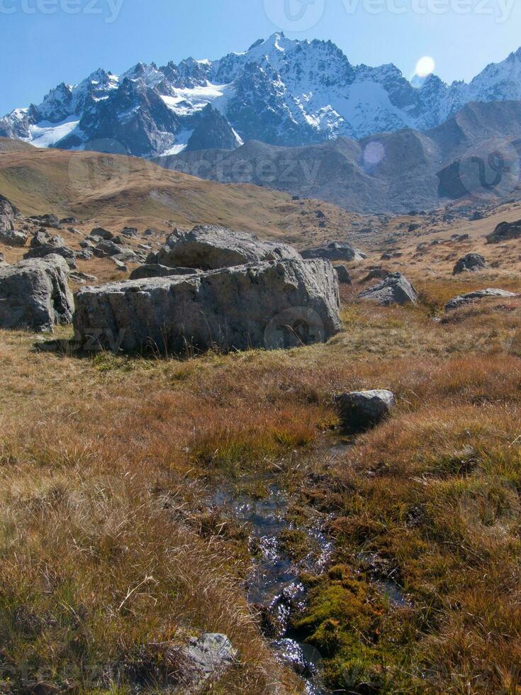 a mountain range in the background photo