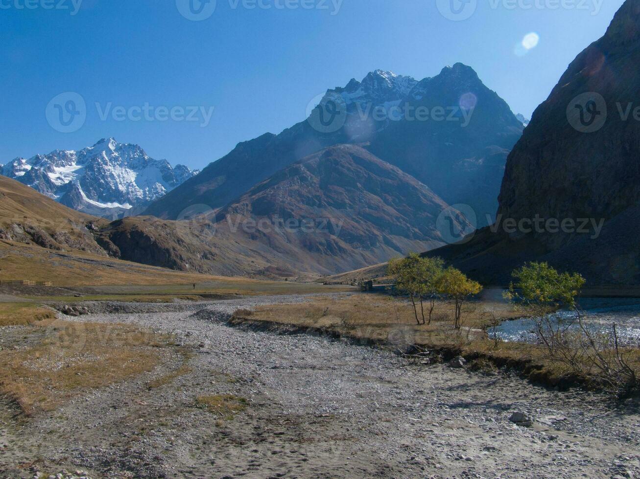 a river in the middle of a field photo