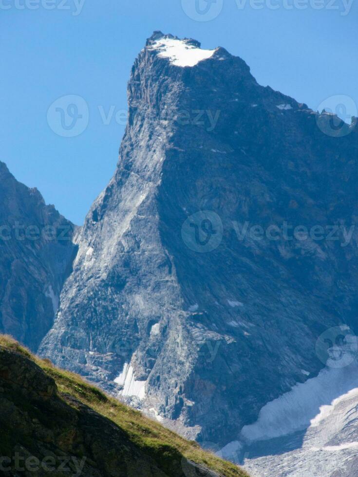 a mountain with snow on it photo