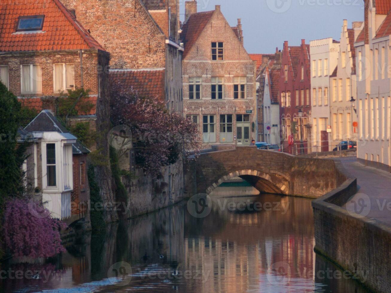 a canal with a bridge photo