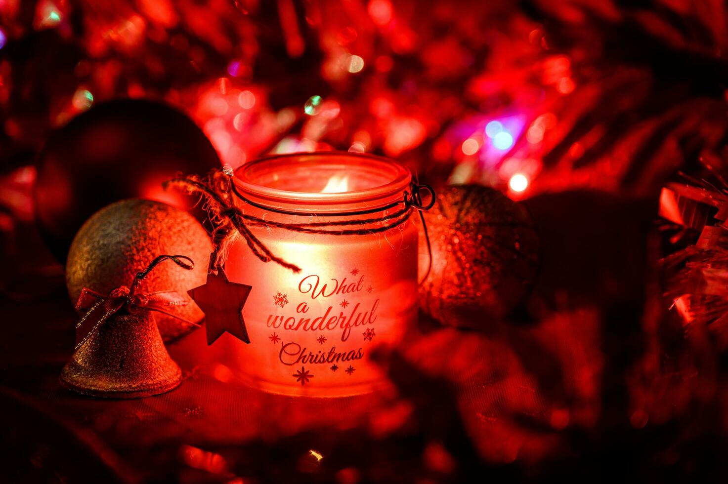 Decorative Christmas background with hanging bauble and candle photo