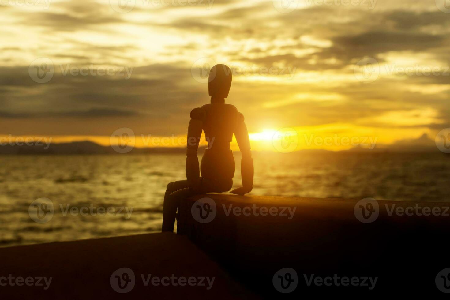 Silhouettes of wooden models feel lonely at sunset. photo