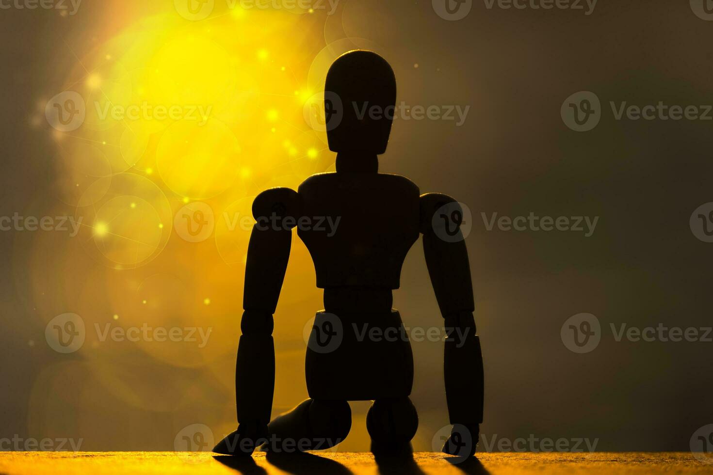 Silhouettes of wooden models feel lonely with bokeh sunlight. photo