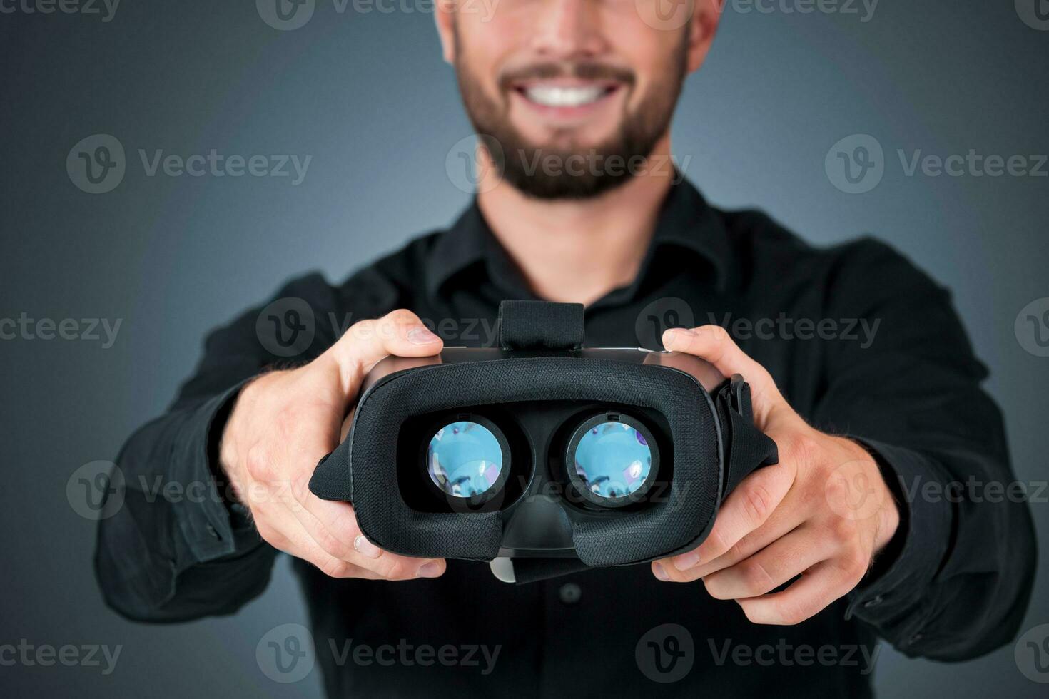 Excited young man using a VR headset photo