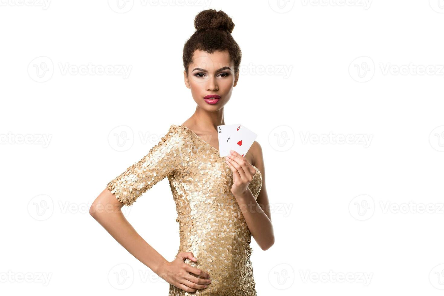 Beautiful young woman holding two ace of cards in her hand isolated on white photo