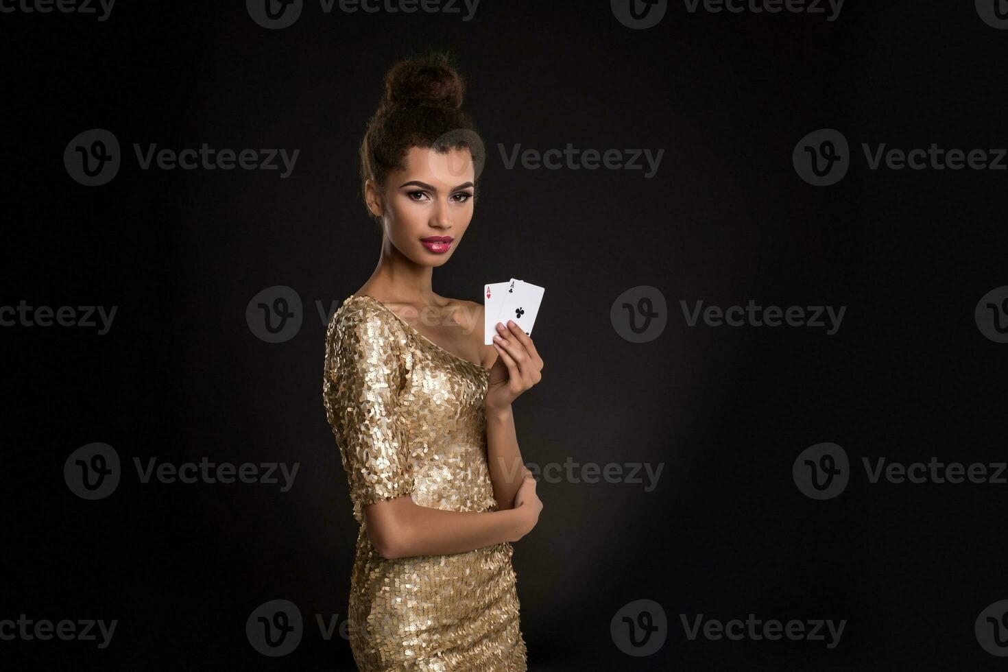 Pretty african girl shows two aces in casino poker and win photo