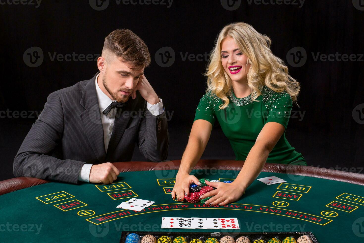 couple playing poker at the table. photo