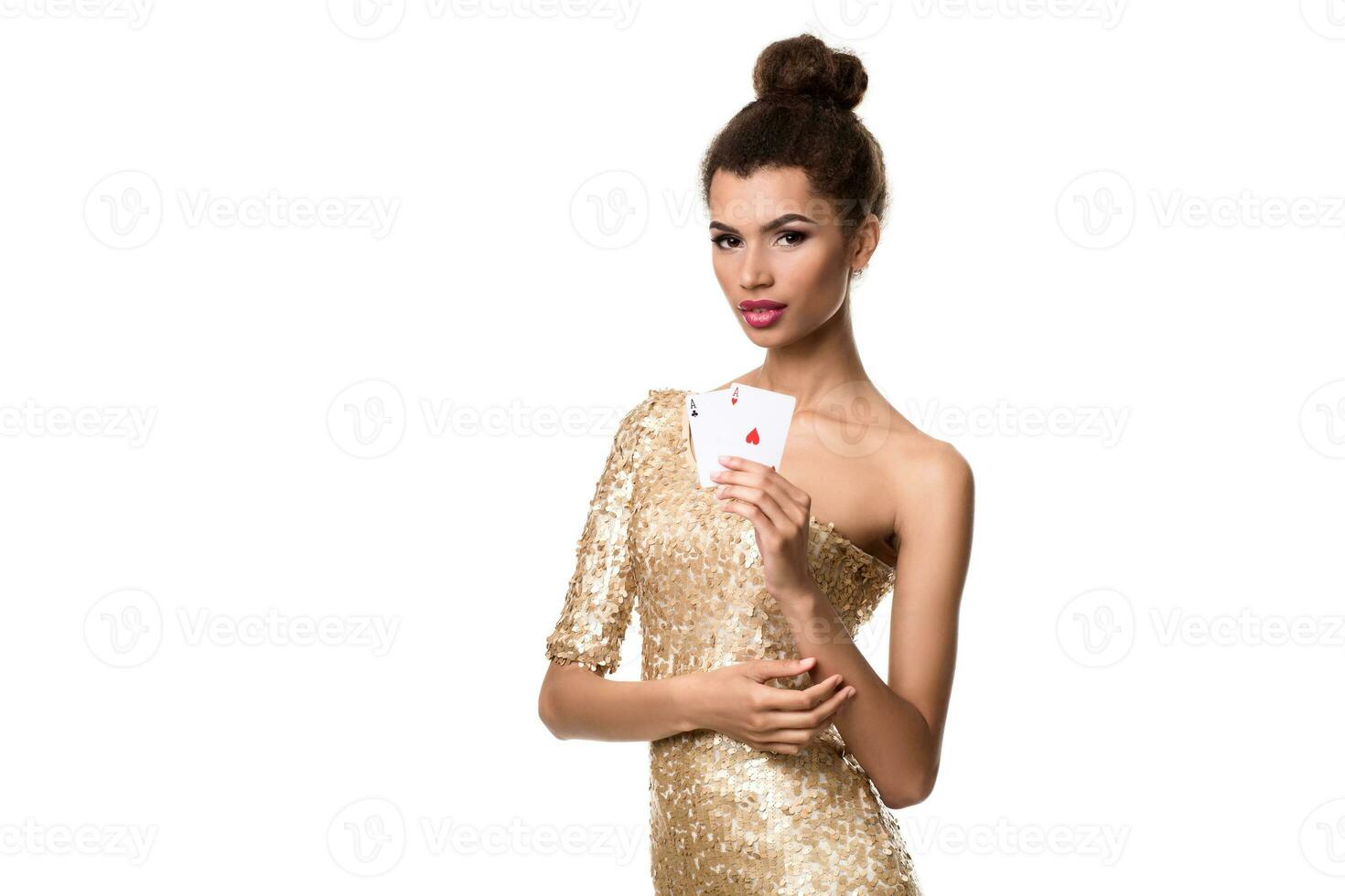 Pretty african girl shows two aces in casino poker and win photo