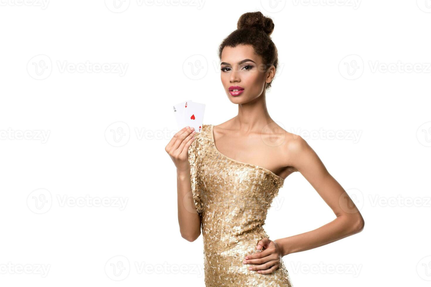 Beautiful young woman holding two ace of cards in her hand isolated on white photo