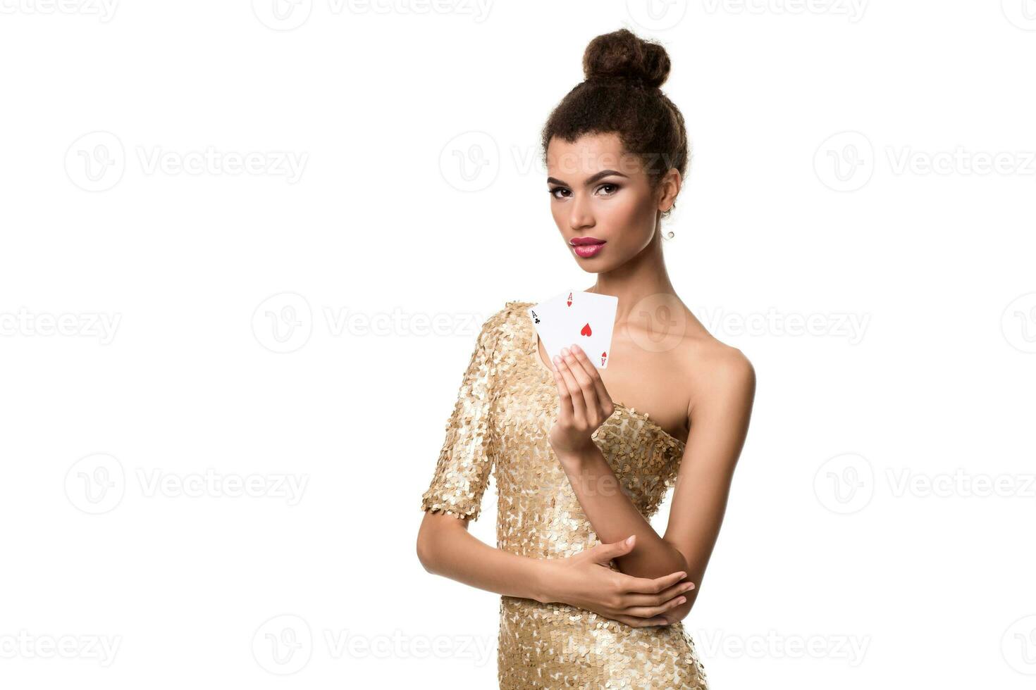 Beautiful young woman holding two ace of cards in her hand isolated on white photo