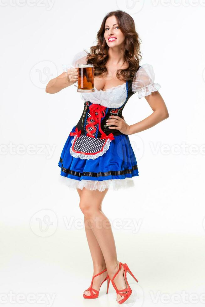 Beautiful young brunette girl of oktoberfest beer stein photo