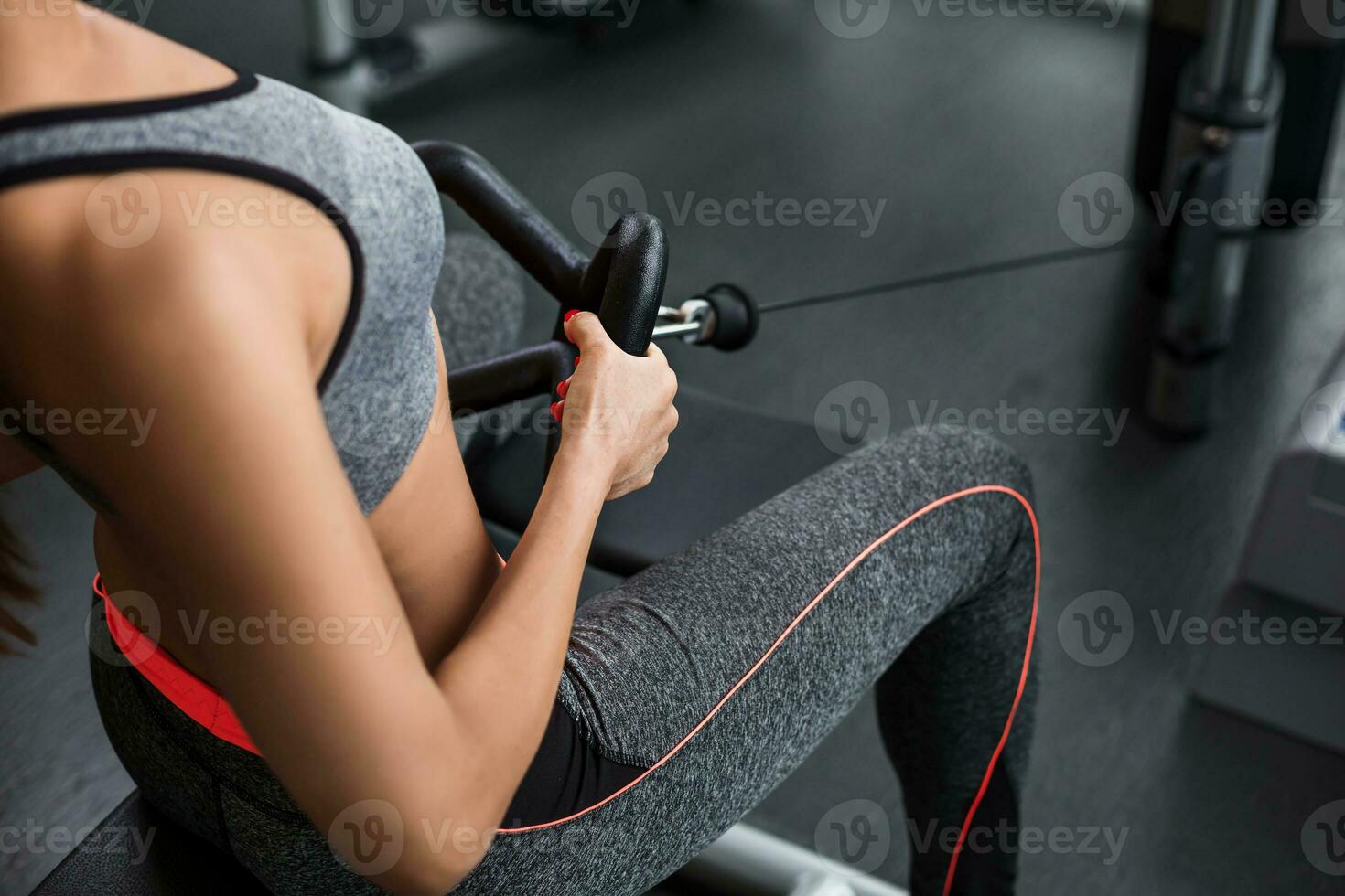 Photo of woman doing exercises on the simulator