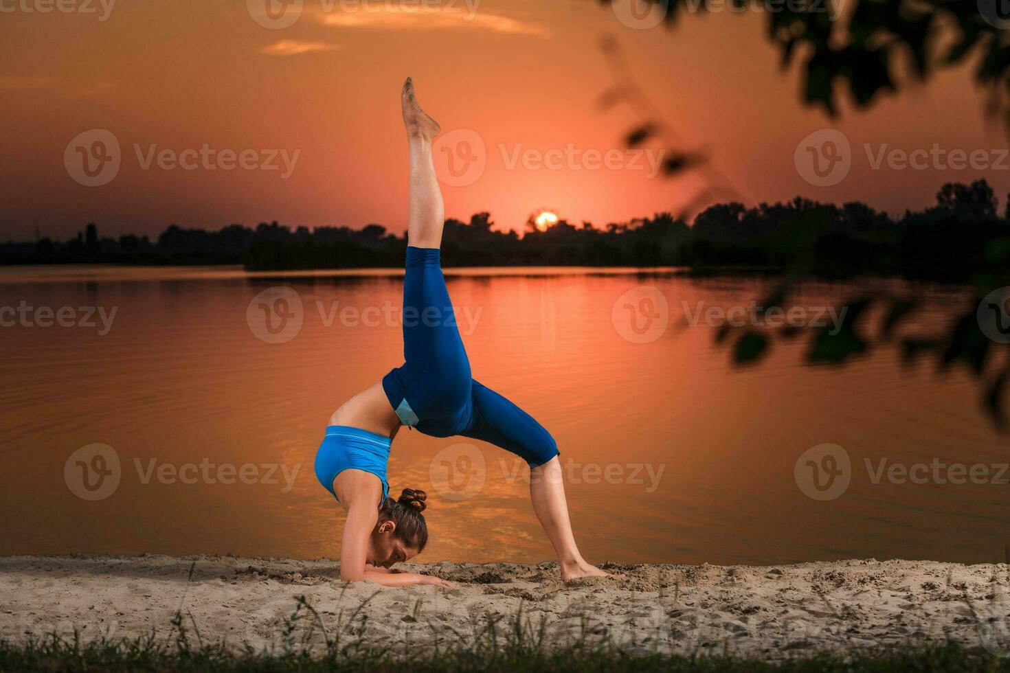 yoga at sunset on the beach. photo