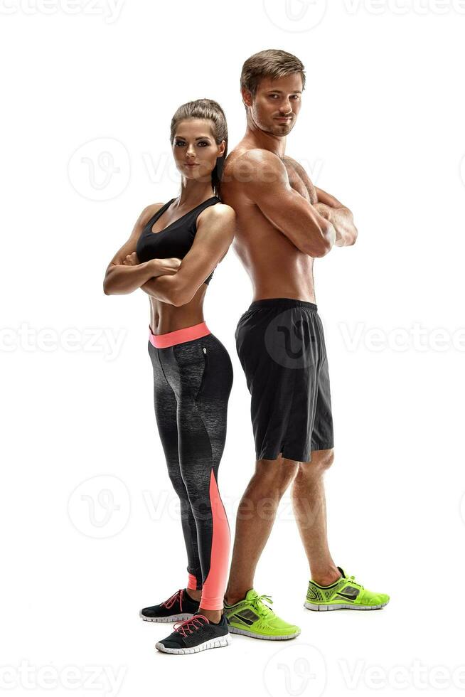 Young sportsmen couple woman and man in studio on white background photo