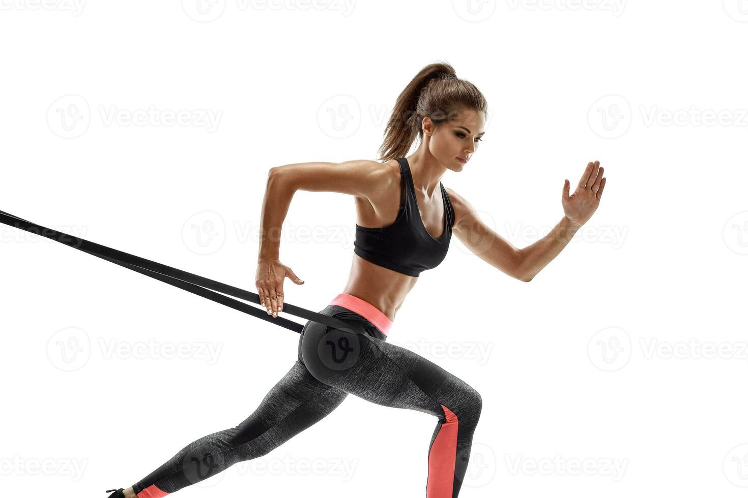 Woman exercising fitness resistance bands in studio silhouette isolated on white background photo